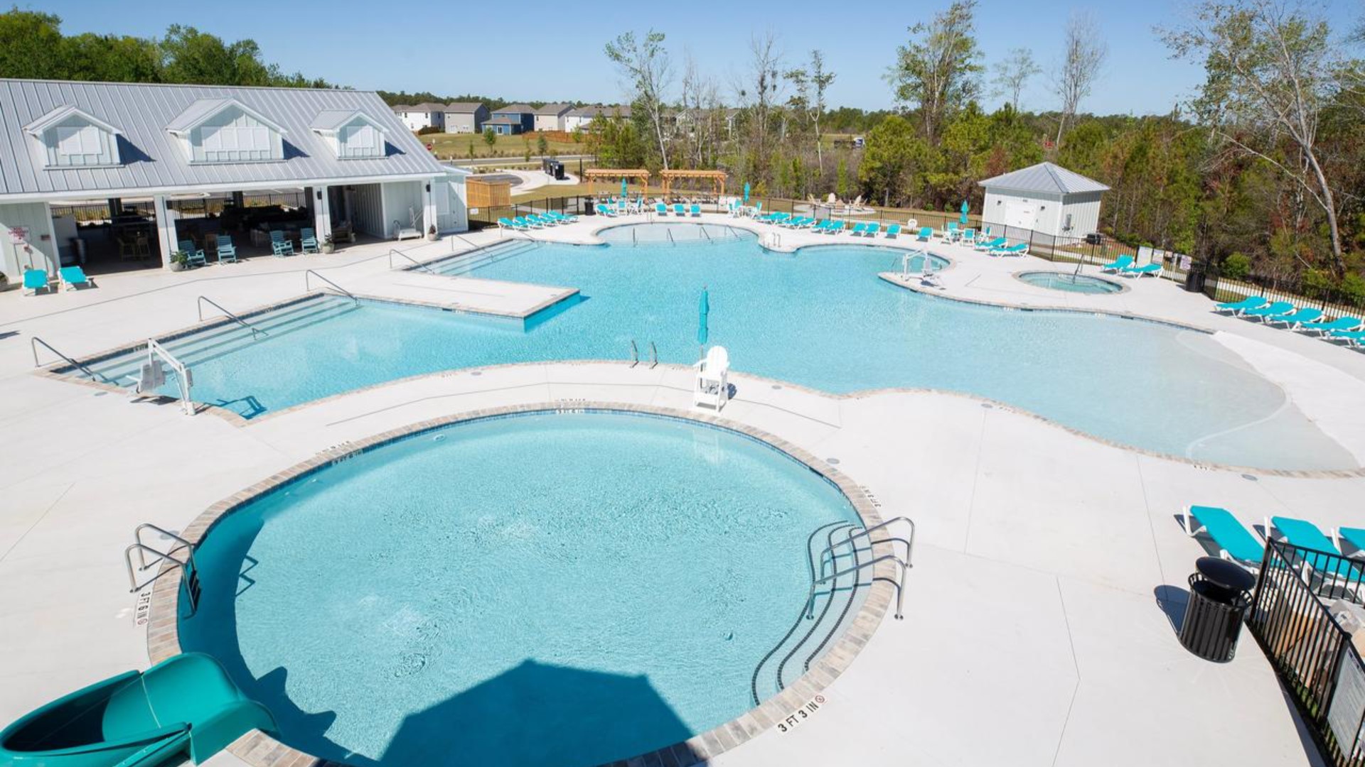 The Amenity Center includes a resort-style pool, clubhouse with kitchen, splash pad, waterslide, playground, pickleball, grill area, outdoor kitchen and fire pit.
