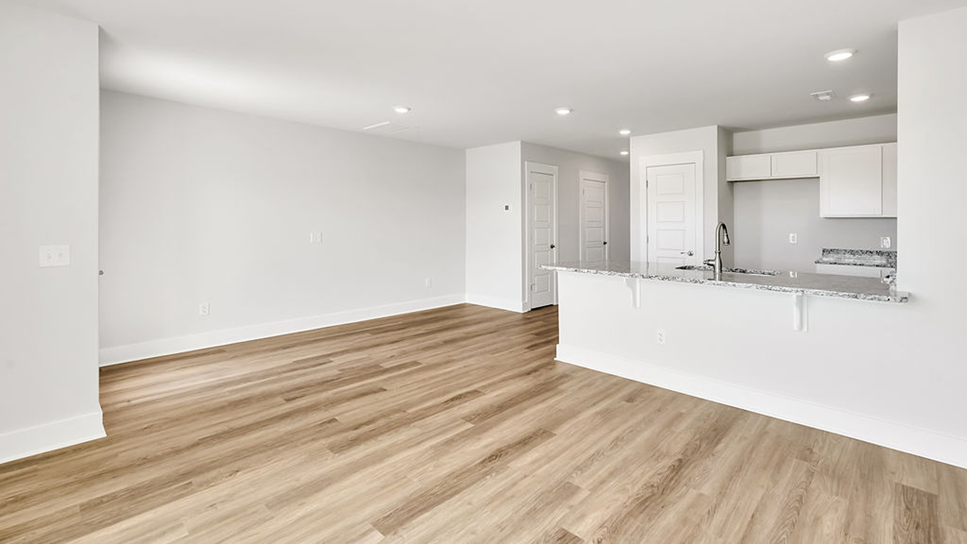 You’ll love the open concept design, never too far from the action with the living and dining area right there.