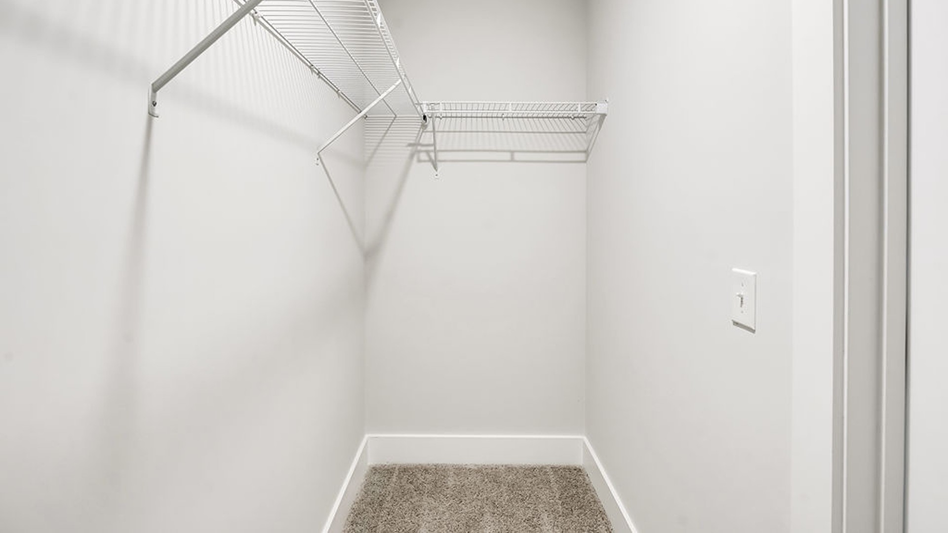 The second floor features the primary bedroom with a walk-in closet and double vanities.