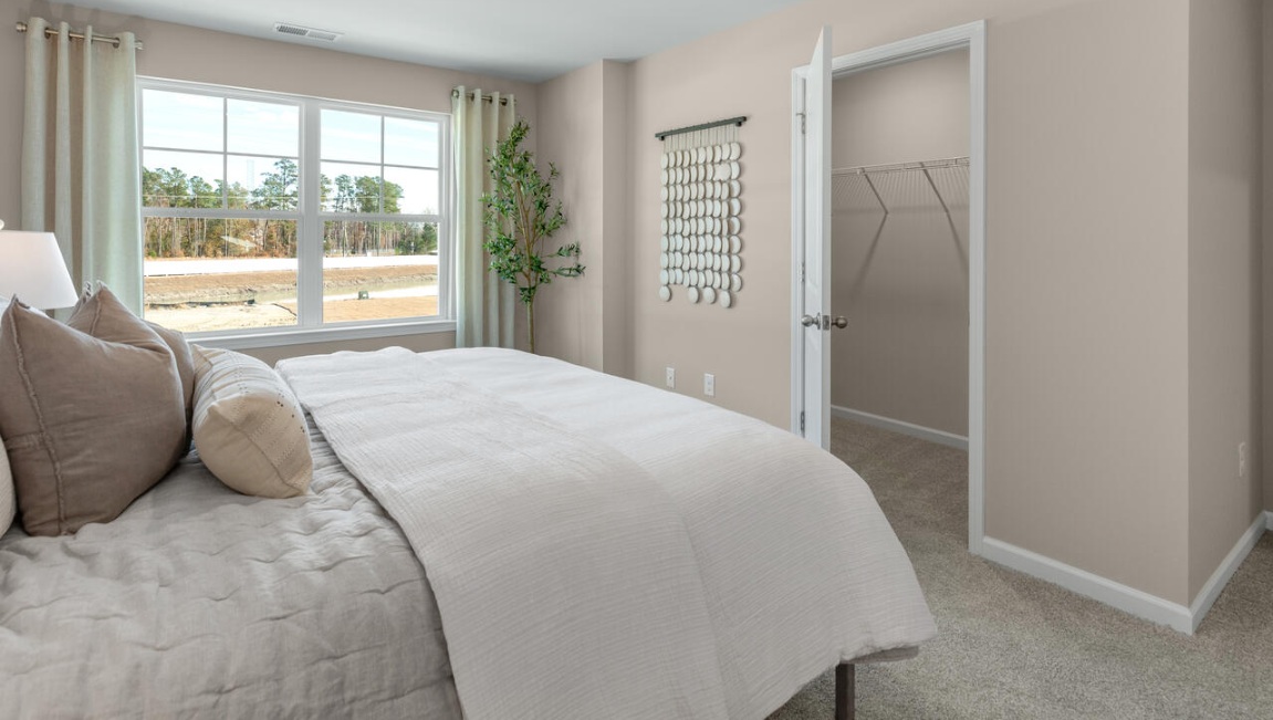 The second floor features the primary bedroom with a walk-in closet and double vanities.