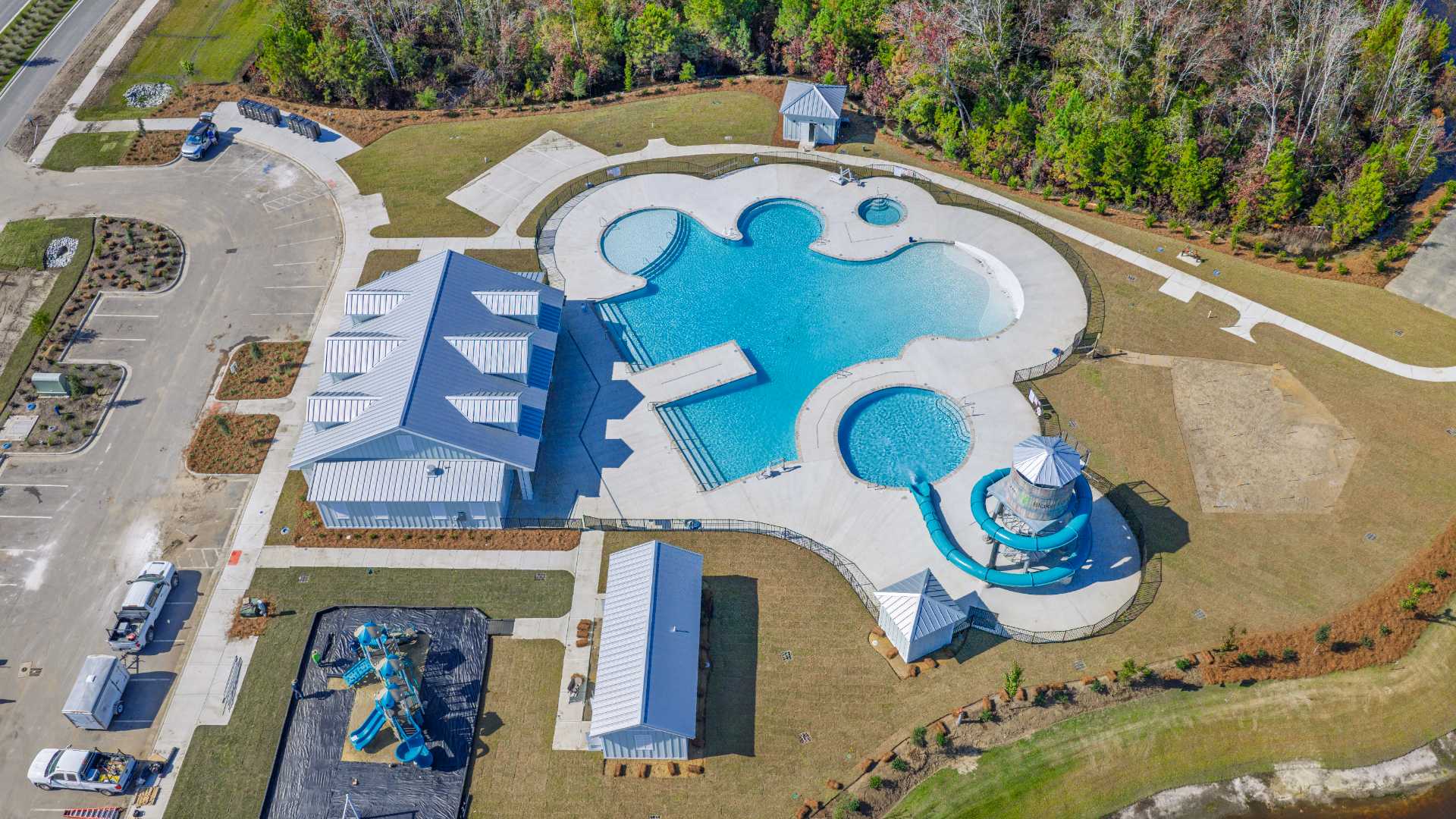 The  Amenity Center will include a resort-style pool, clubhouse with kitchen, splash pad, waterslide, playground, pickleball, grill area, outdoor kitchen and fire pit.