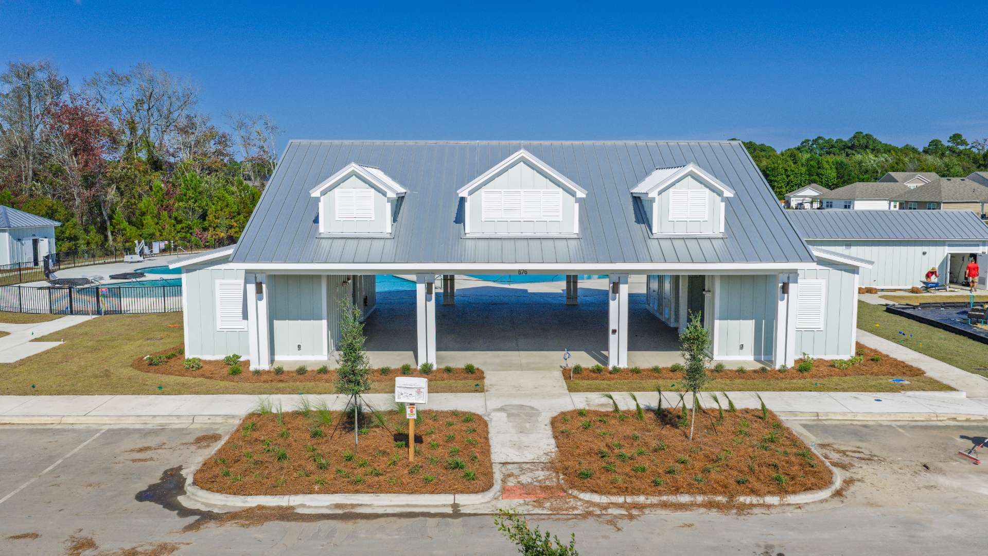 The  Amenity Center will include a resort-style pool, clubhouse with kitchen, splash pad, waterslide, playground, pickleball, grill area, outdoor kitchen and fire pit.