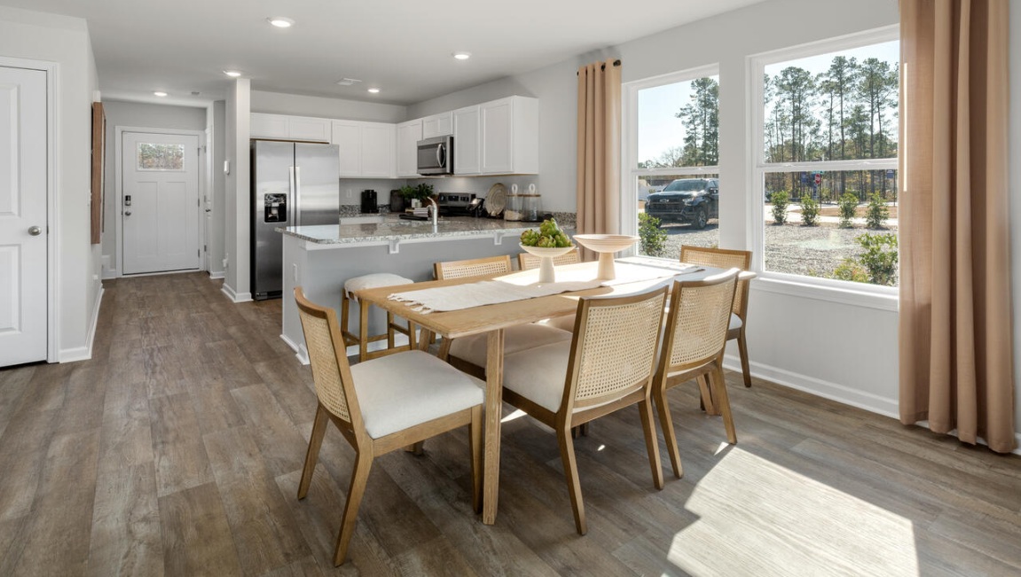 Your new Norman features an open concept first floor anchored by a spacious kitchen with granite countertops, stainless steel appliances and a peninsula bar that overlooks your family and dining room. Ideal for entertaining guests or enjoying family time while preparing meals.