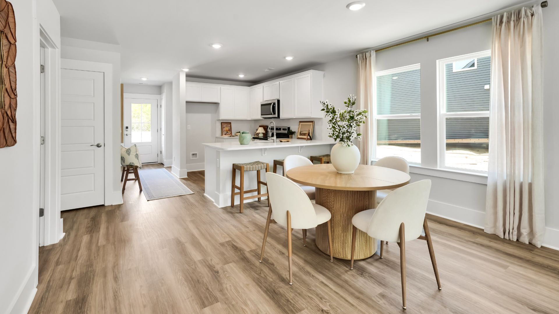 our new Norman features an open concept first floor anchored by a spacious kitchen with granite countertops, stainless steel appliances and a peninsula bar that overlooks your family and dining room. Ideal for entertaining guests or enjoying family time while preparing meals.