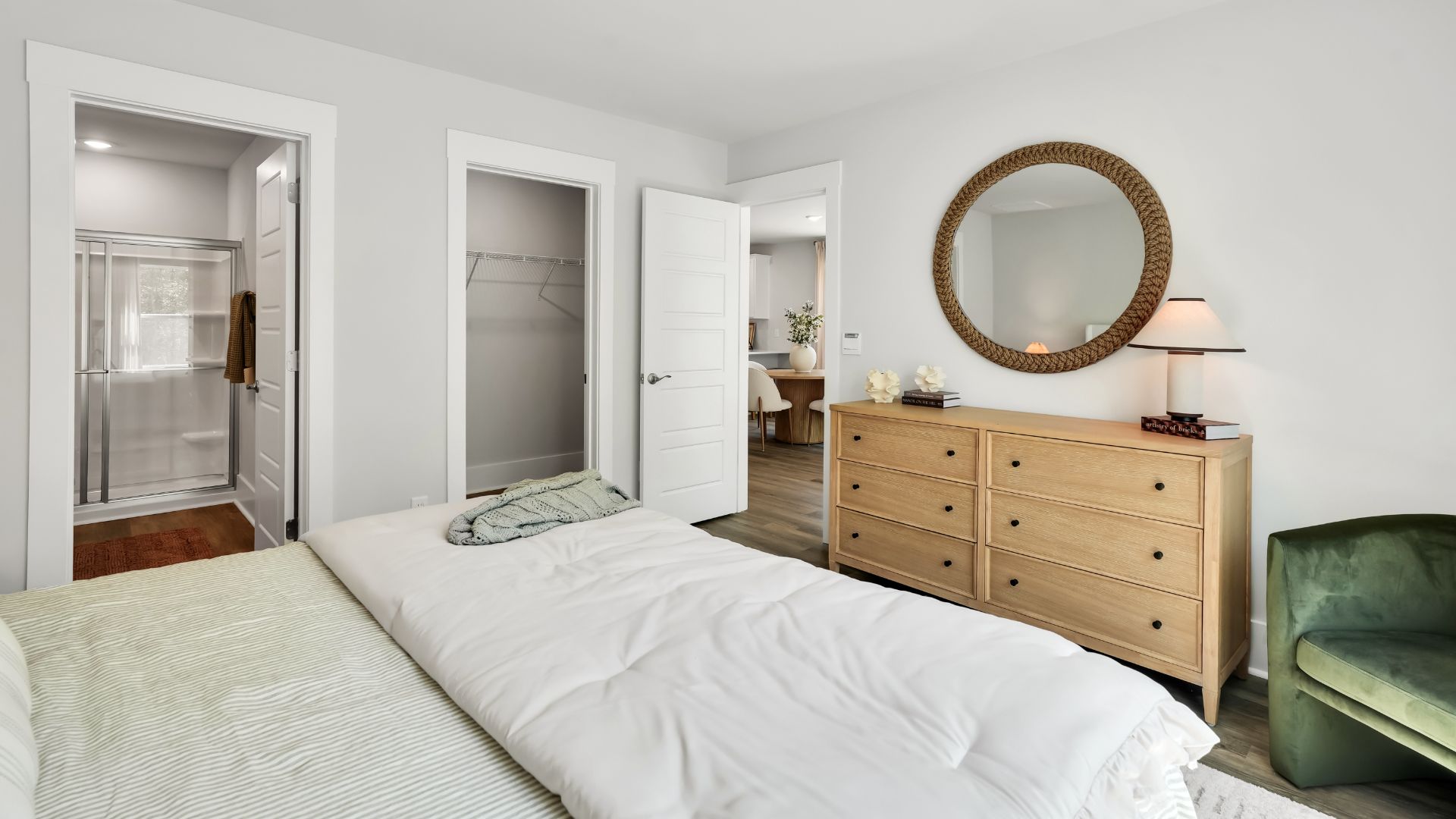 The first floor features the primary bedroom with a walk-in closet and double vanities