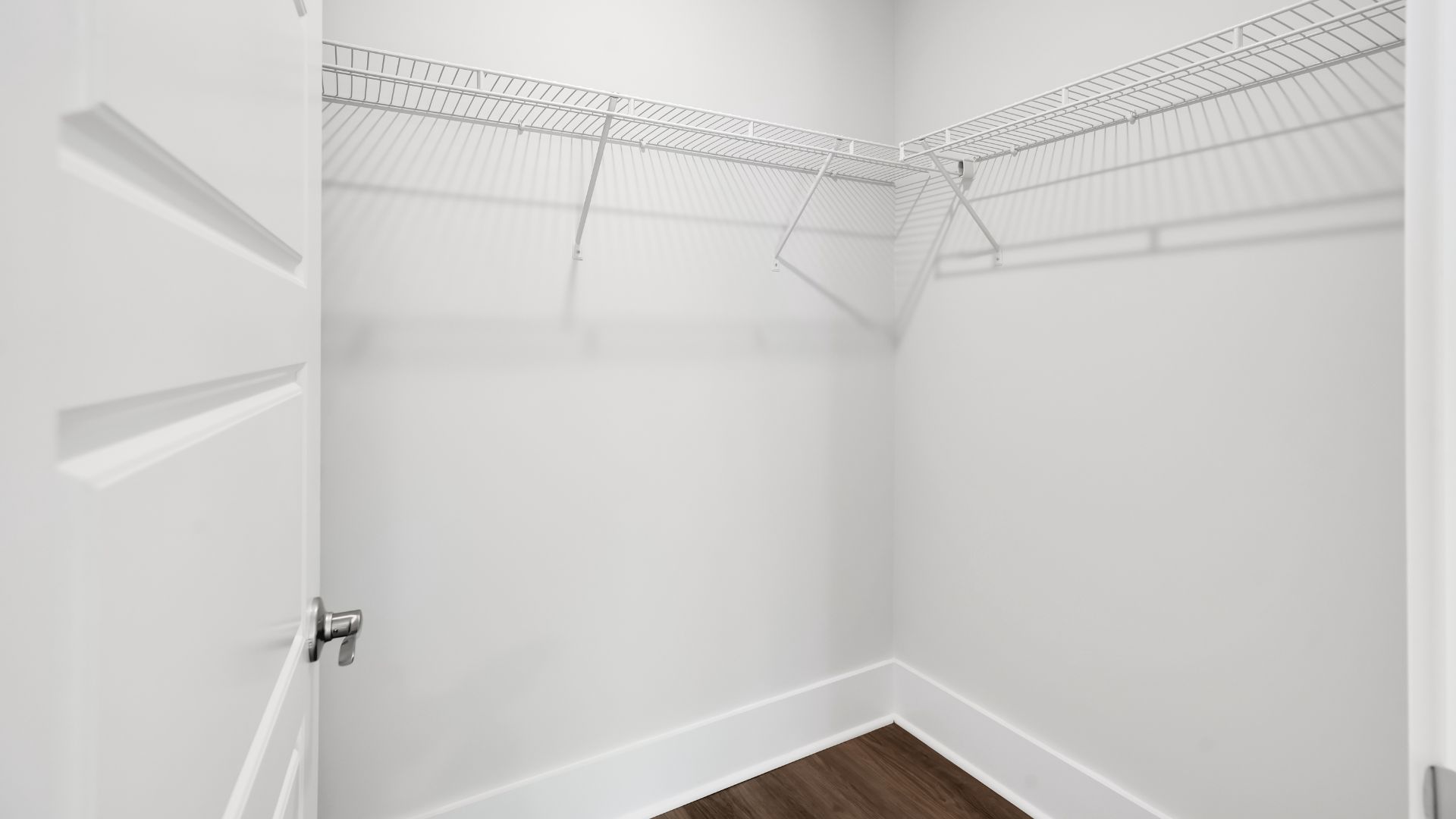 The first floor features the primary bedroom with a walk-in closet and double vanities