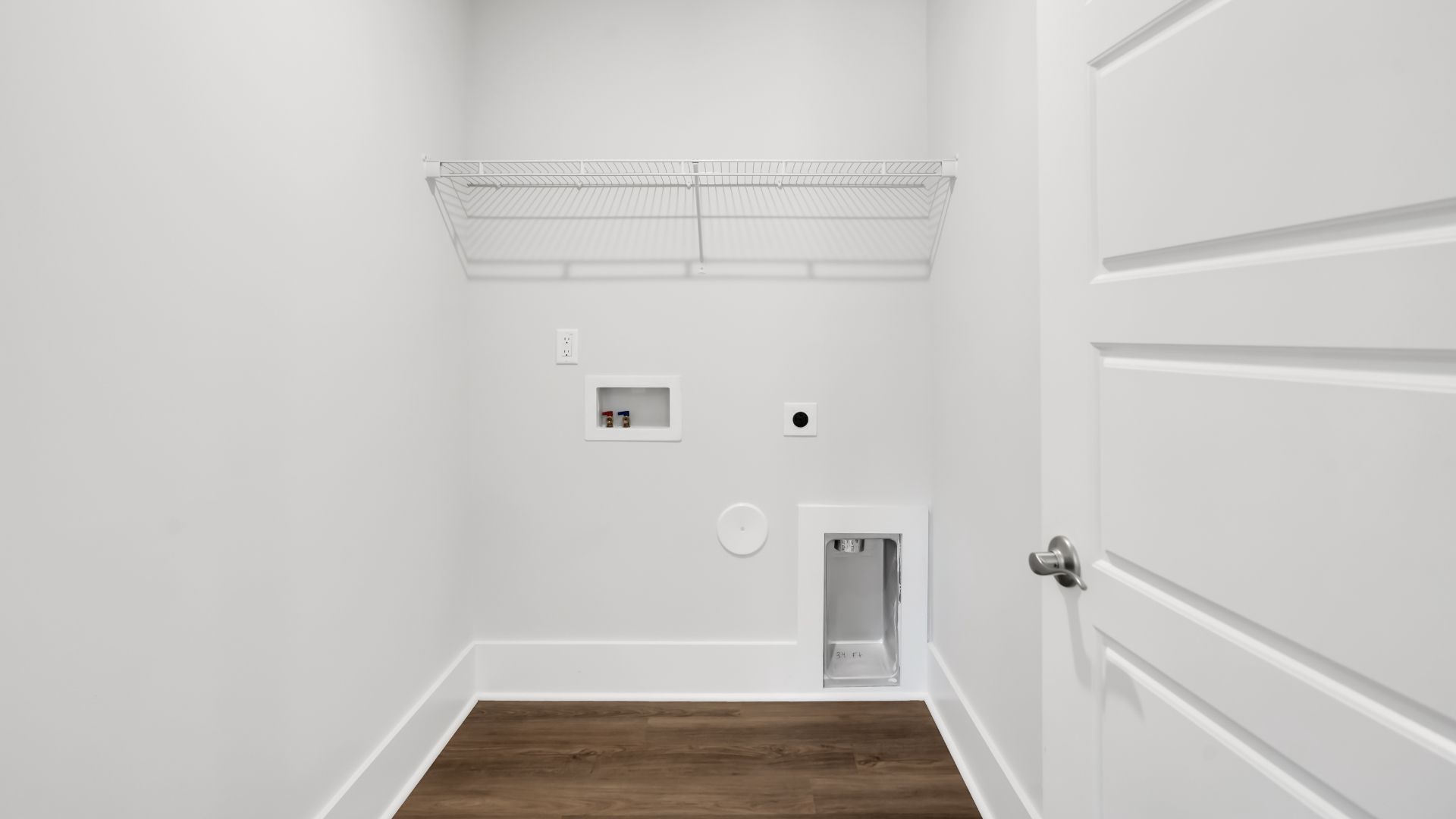 The first floor features the primary bedroom with a walk-in closet and double vanities