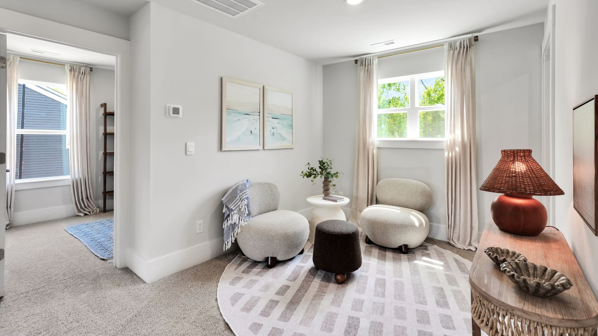 Upstairs there are 3 more bedrooms, a shared bathroom and a loft area, adding to the flexibility of the layout. For those in search of a contemporary townhome with a functional layout, the Norman is an excellent choice.