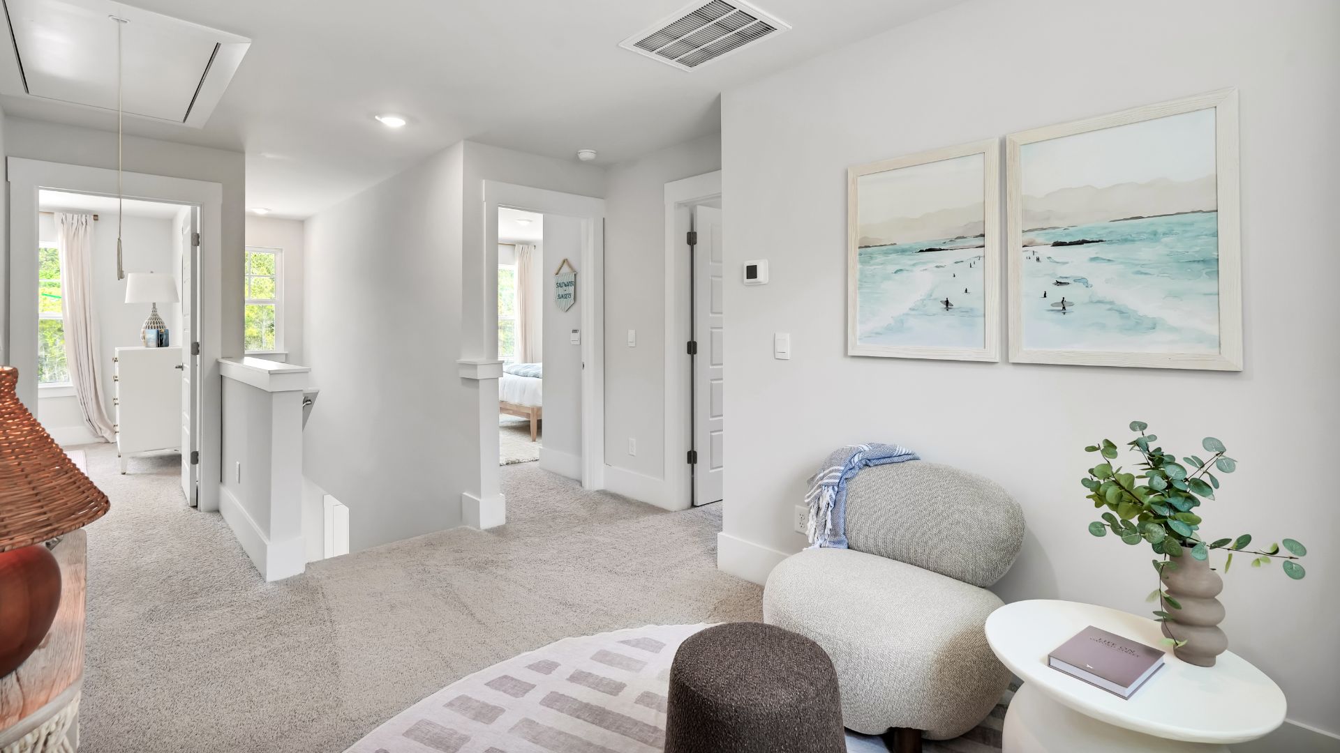 Upstairs there are 3 more bedrooms, a shared bathroom and a loft area, adding to the flexibility of the layout. For those in search of a contemporary townhome with a functional layout, the Norman is an excellent choice.