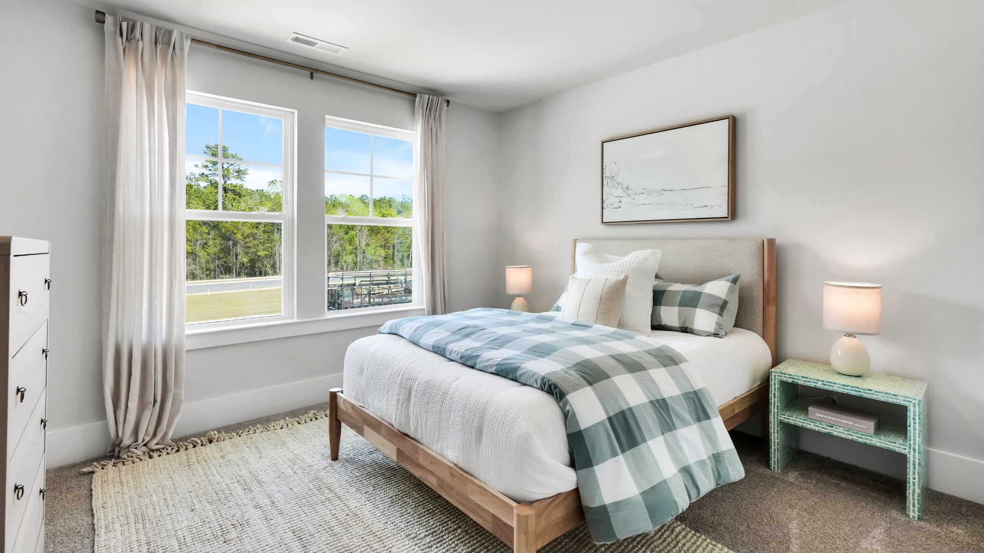 Upstairs there are 3 more bedrooms, a shared bathroom and a loft area, adding to the flexibility of the layout. For those in search of a contemporary townhome with a functional layout, the Norman is an excellent choice.