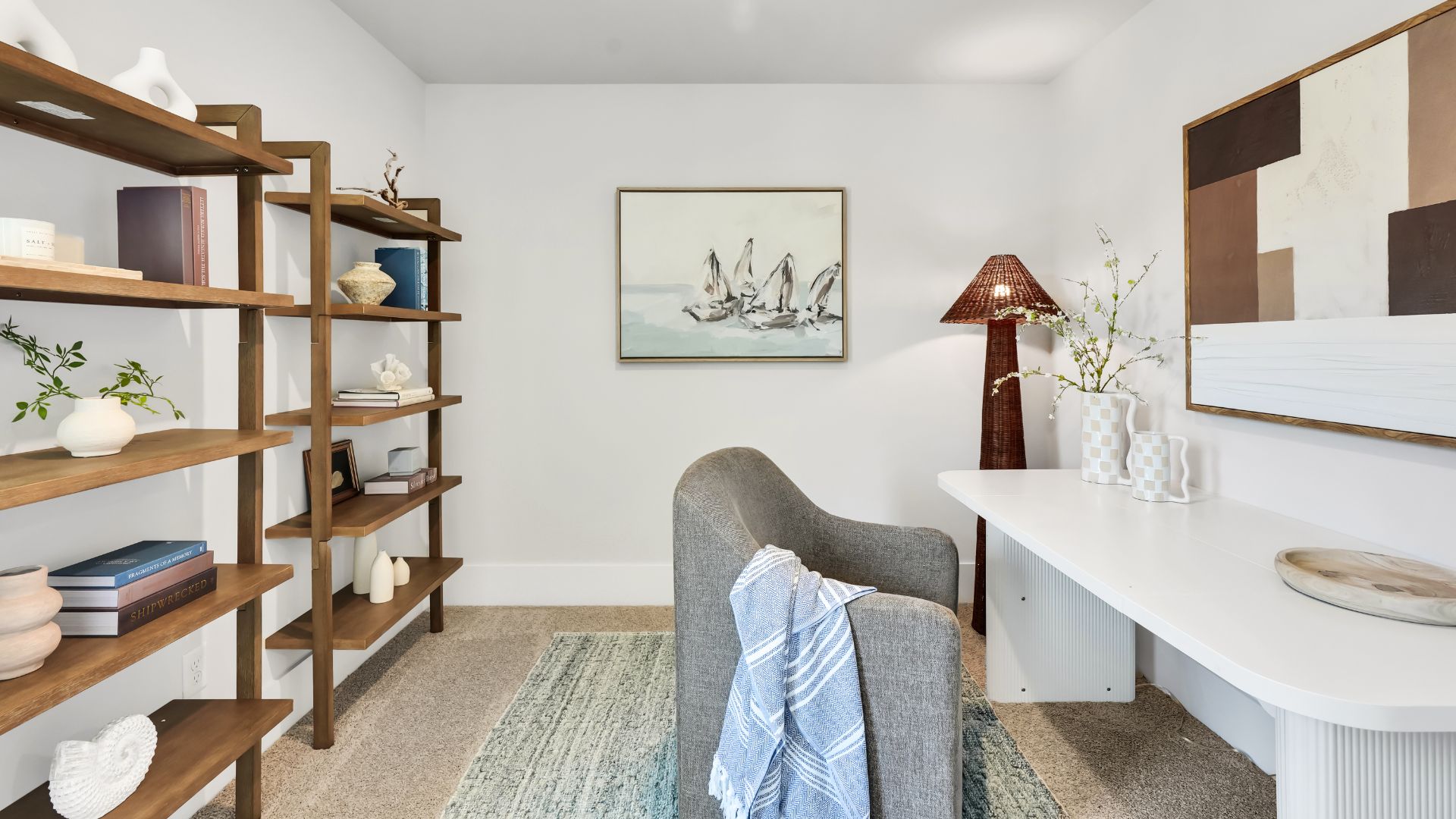 Upstairs there are 3 more bedrooms, a shared bathroom and a loft area, adding to the flexibility of the layout. For those in search of a contemporary townhome with a functional layout, the Norman is an excellent choice.