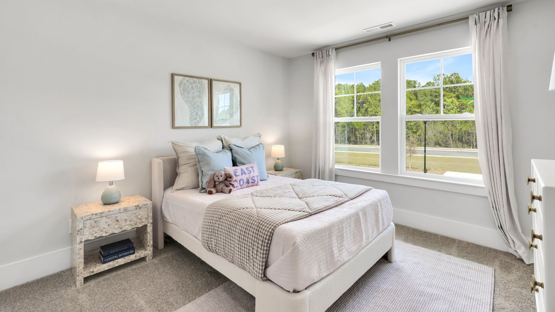 Upstairs there are 3 more bedrooms, a shared bathroom and a loft area, adding to the flexibility of the layout. For those in search of a contemporary townhome with a functional layout, the Norman is an excellent choice.