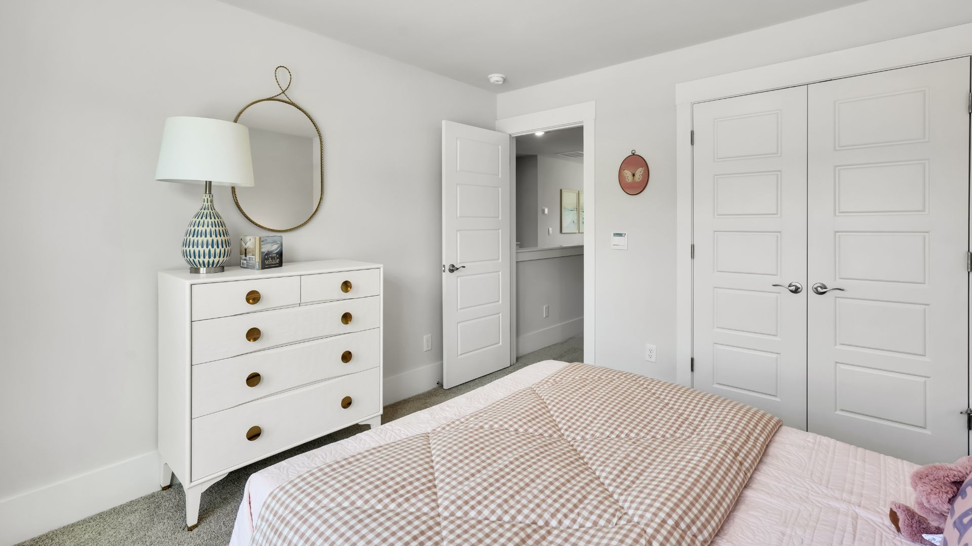 Upstairs there are 3 more bedrooms, a shared bathroom and a loft area, adding to the flexibility of the layout. For those in search of a contemporary townhome with a functional layout, the Norman is an excellent choice.