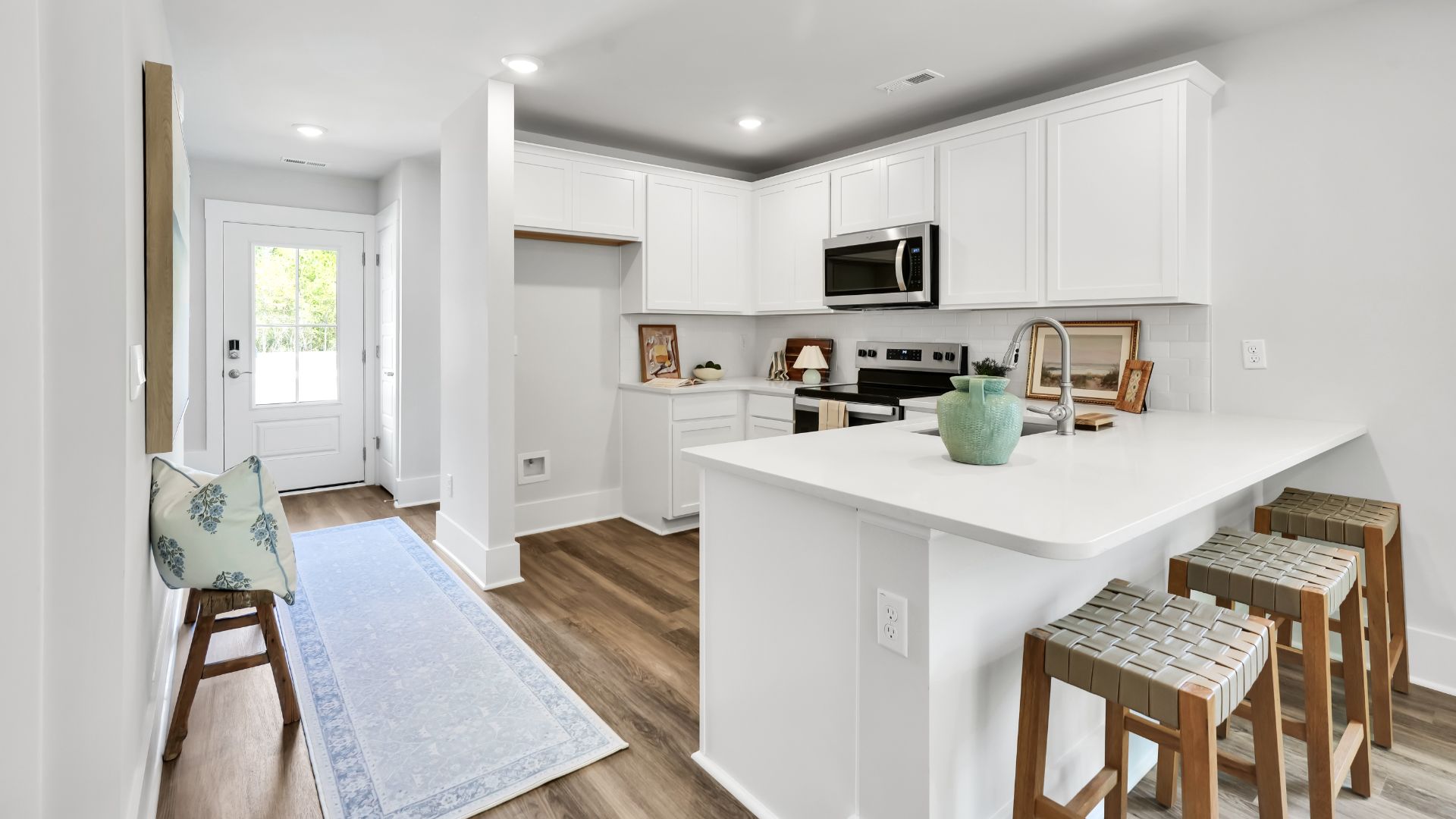 Your new Norman features an open concept first floor anchored by a spacious kitchen with granite countertops, stainless steel appliances and a peninsula bar that overlooks your family and dining room. Ideal for entertaining guests or enjoying family time while preparing meals.