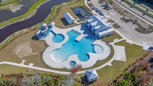 The amenity center that will include a swimming pool, multi-sport court, splashpad, playground, and fire pit, ensuring a well-rounded and enjoyable living experience.