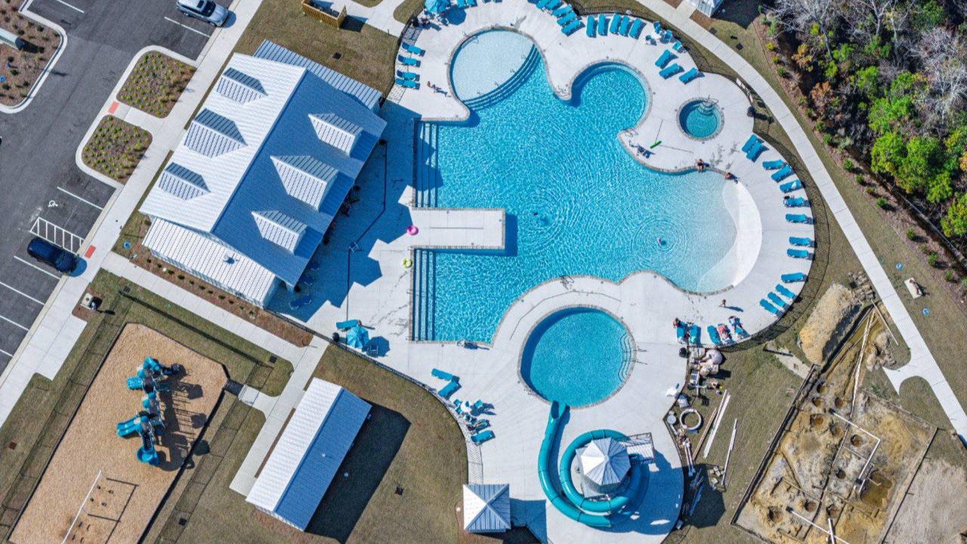 The amenity center that will include a swimming pool, multi-sport court, splashpad, playground, and fire pit, ensuring a well-rounded and enjoyable living experience.