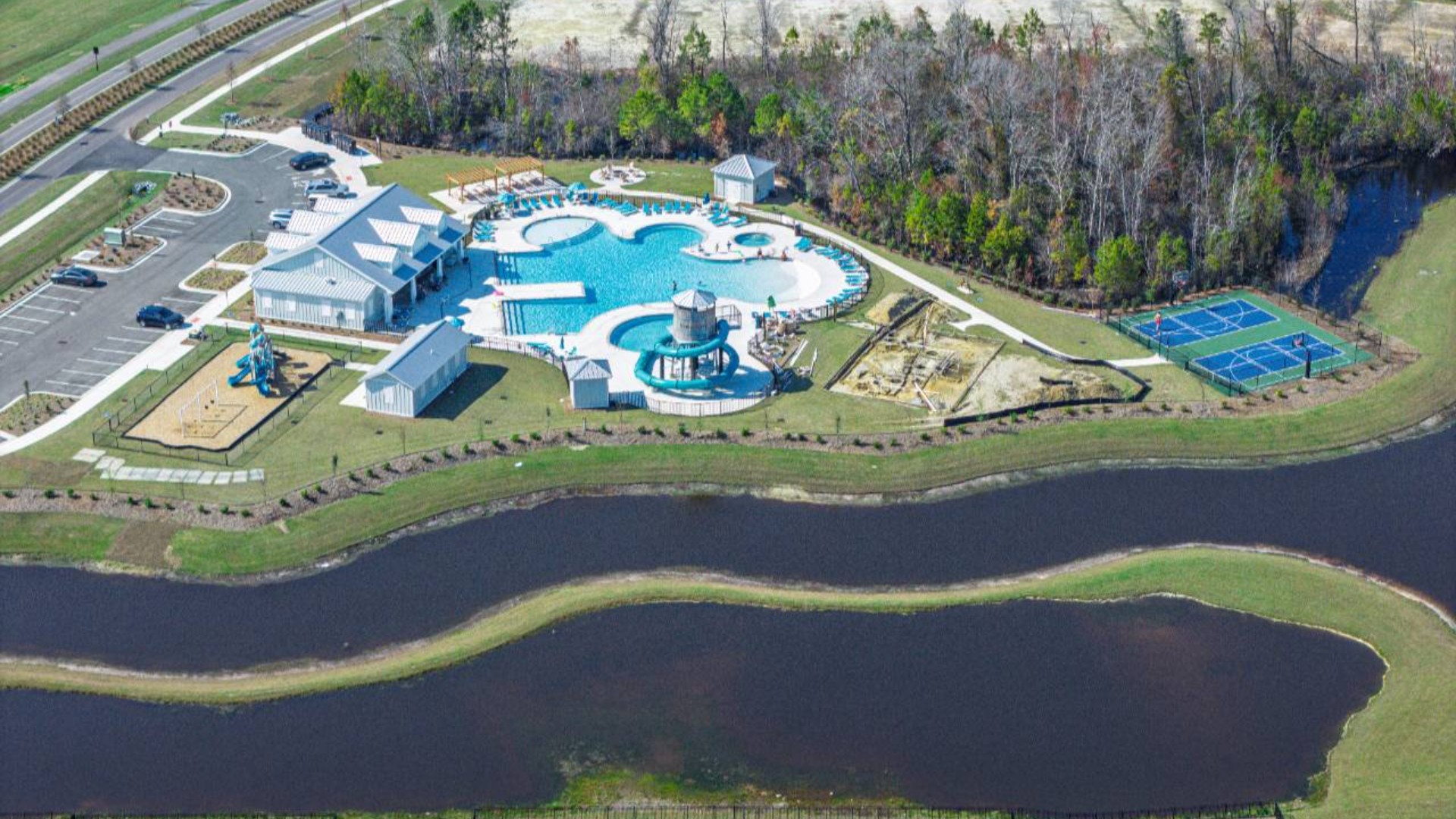 The amenity center that will include a swimming pool, multi-sport court, splashpad, playground, and fire pit, ensuring a well-rounded and enjoyable living experience.