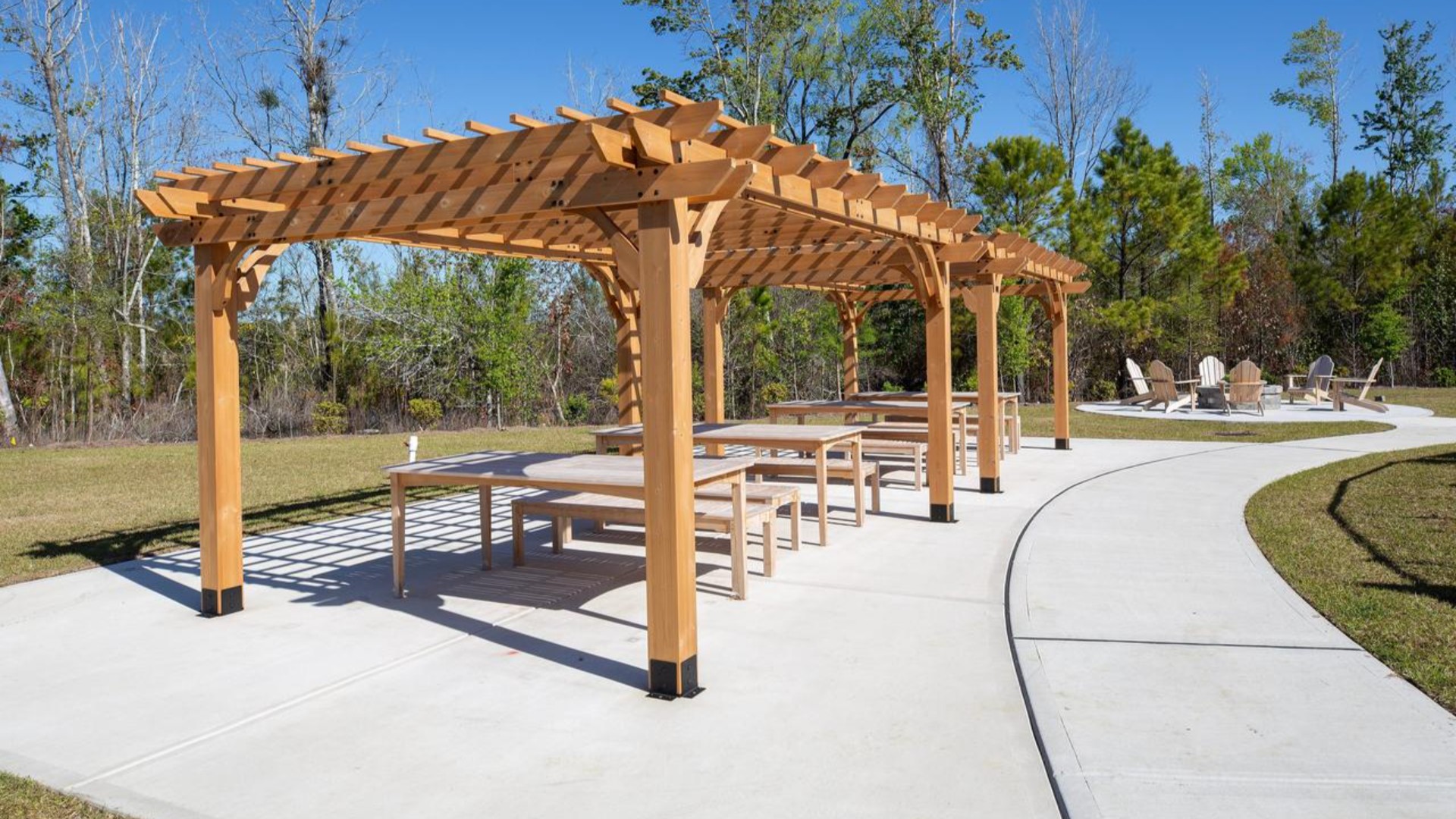 The amenity center that includes a swimming pool, multi-sport court, splashpad, playground, and fire pit, ensuring a well-rounded and enjoyable living experience.