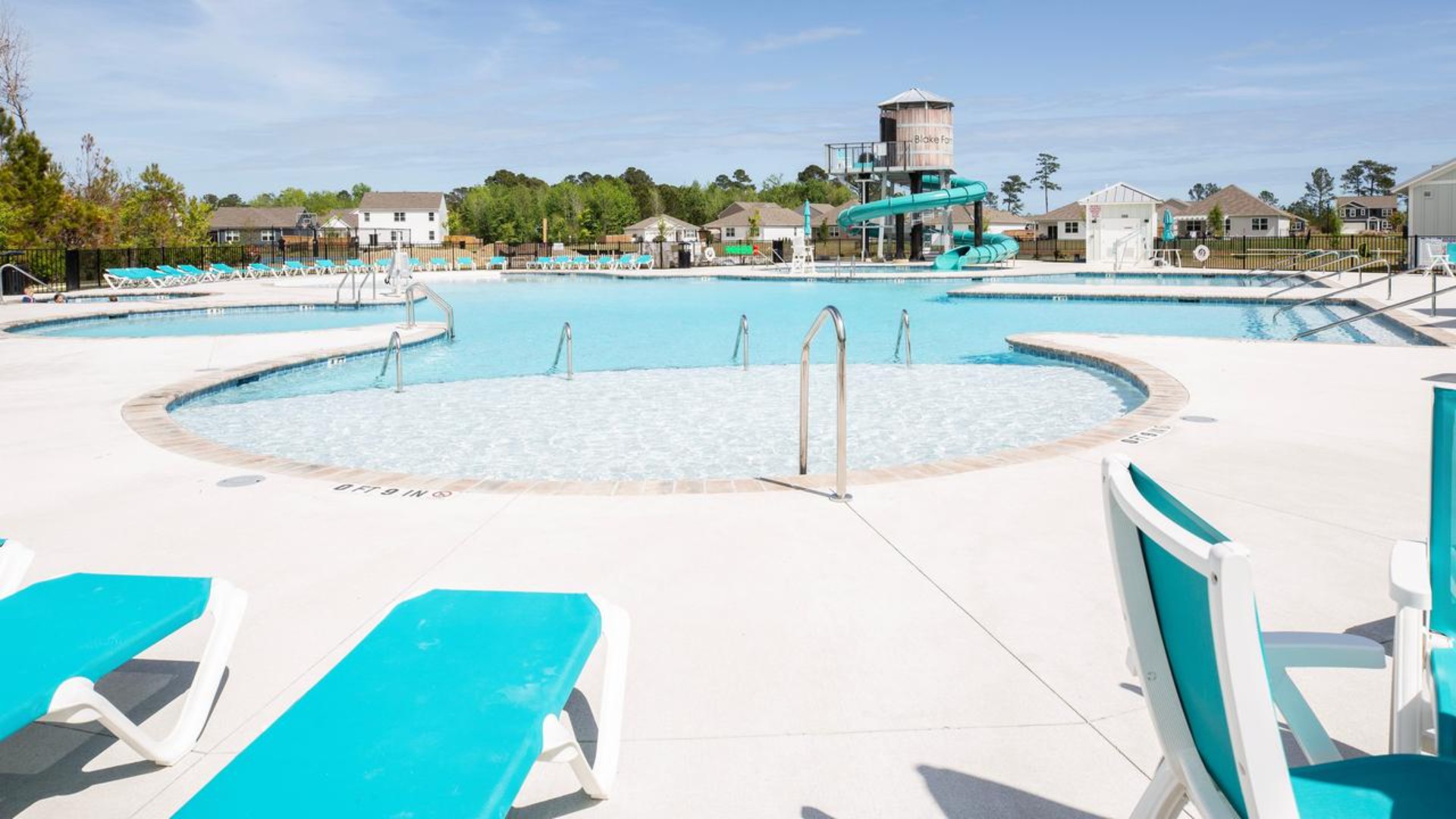 The amenity center that includes a swimming pool, multi-sport court, splashpad, playground, and fire pit, ensuring a well-rounded and enjoyable living experience.
