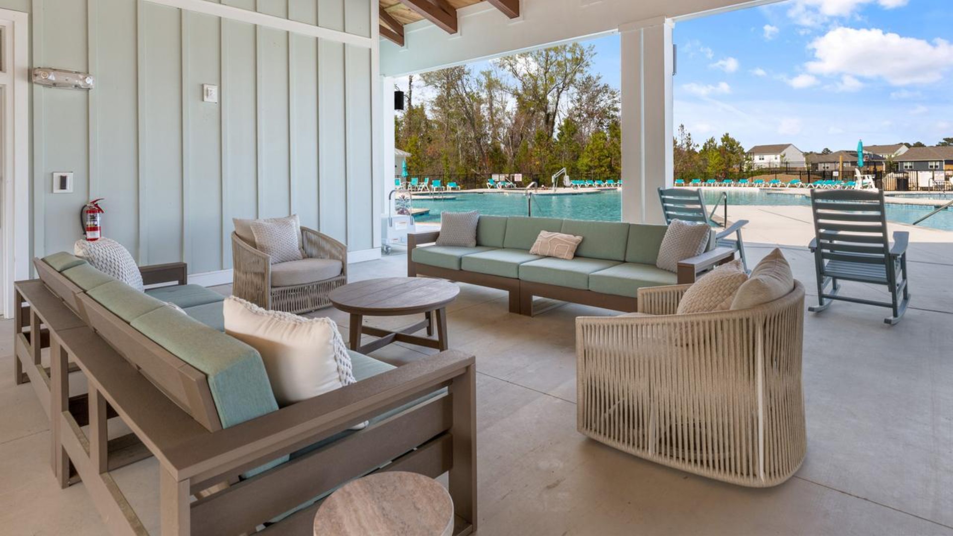 The amenity center that includes a swimming pool, multi-sport court, splashpad, playground, and fire pit, ensuring a well-rounded and enjoyable living experience.