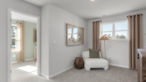 pstairs there are 3 more bedrooms, a shared bathroom and a loft area, adding to the flexibility of the layout. For those in search of a contemporary townhome with a functional layout, the Norman is an excellent choice.