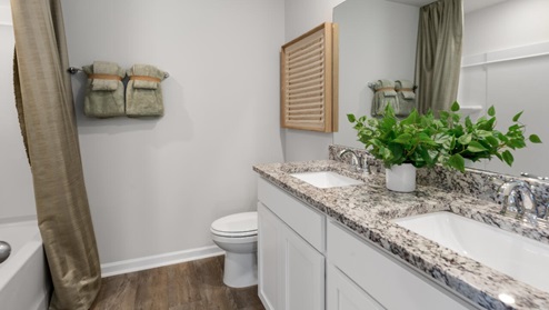 pstairs there are 3 more bedrooms, a shared bathroom and a loft area, adding to the flexibility of the layout. For those in search of a contemporary townhome with a functional layout, the Norman is an excellent choice.