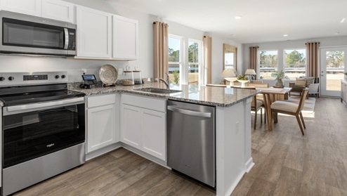 Your new Norman features an open concept first floor anchored by a spacious kitchen with granite countertops, stainless steel appliances and a peninsula bar that overlooks your family and dining room. Ideal for entertaining guests or enjoying family time while preparing meal