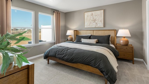 The first floor features the primary bedroom with a walk-in closet and double vanities