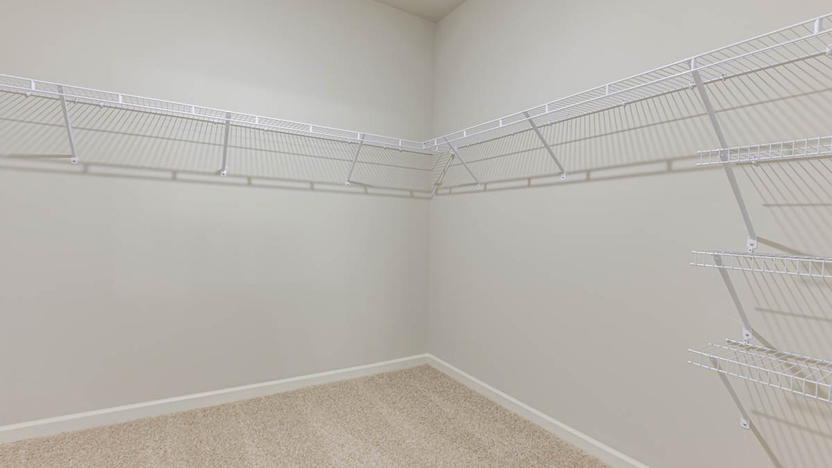 The primary suite serves as a peaceful retreat, featuring an en-suite bathroom with dual vanities and a walk-in closet. The additional bedrooms provide comfort and privacy and share access to a secondary bathroom.