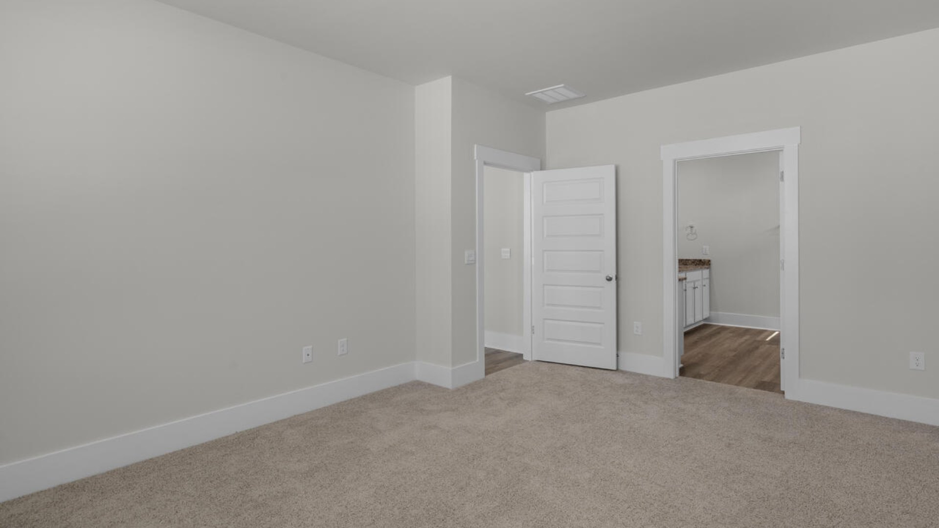 The primary suite as well as on suite is sure to impress with double vanities and a massive walk-in closet