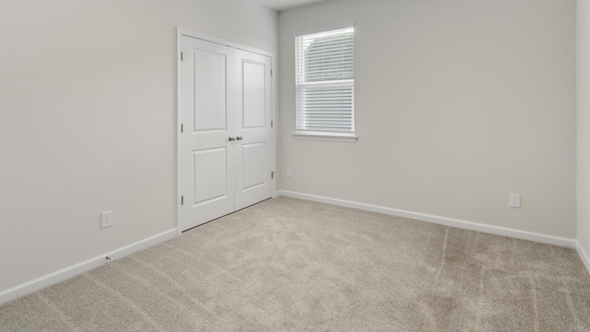 The split bedroom plan creates a private primary bedroom suite featuring two walk-in closets and a spacious en suite bath. There are three bedrooms at the front of the home with a full bathroom as well as laundry room.