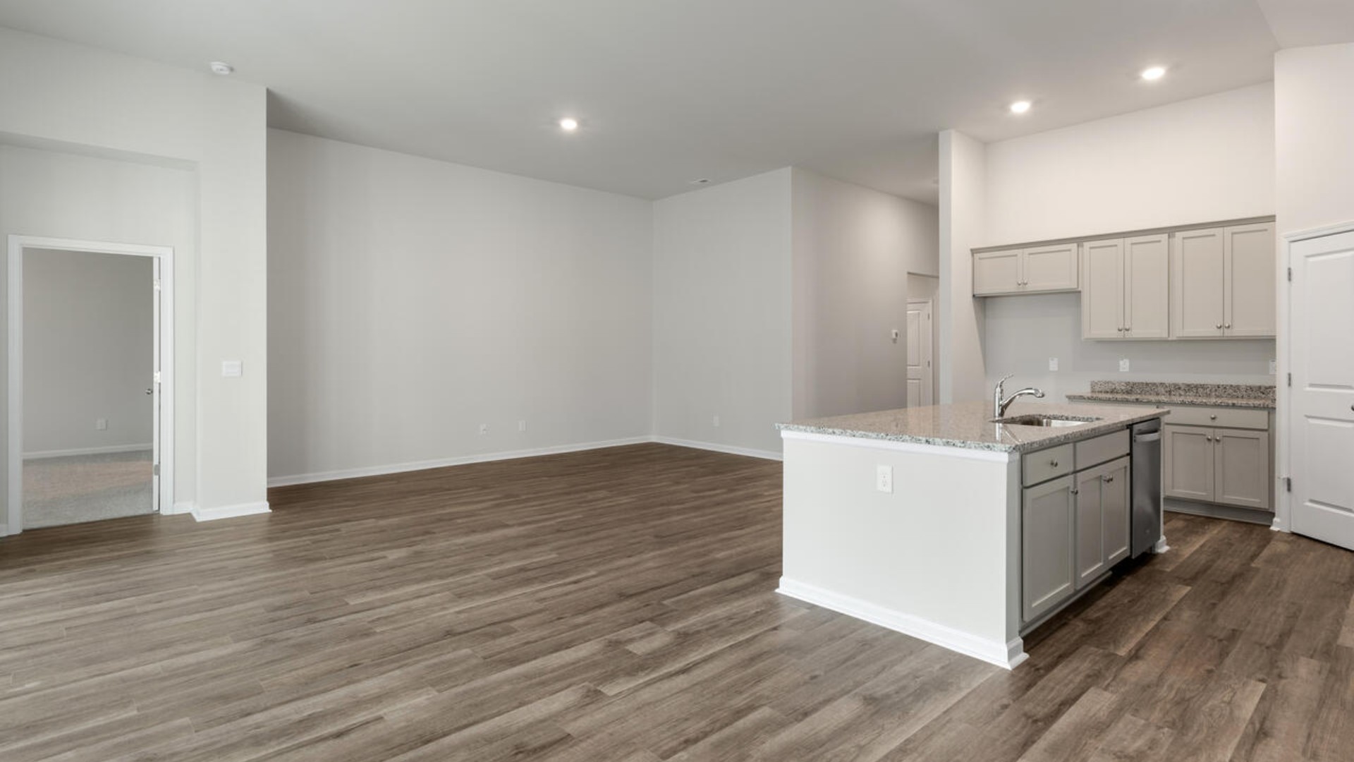 High ceilings and lots of windows create a bright and airy entertaining space. Open concept design with plenty of room for everyone to gather around the huge kitchen island.