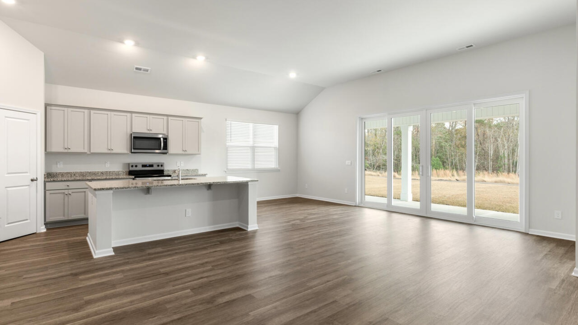 High ceilings and lots of windows create a bright and airy entertaining space. Open concept design with plenty of room for everyone to gather around the huge kitchen island.