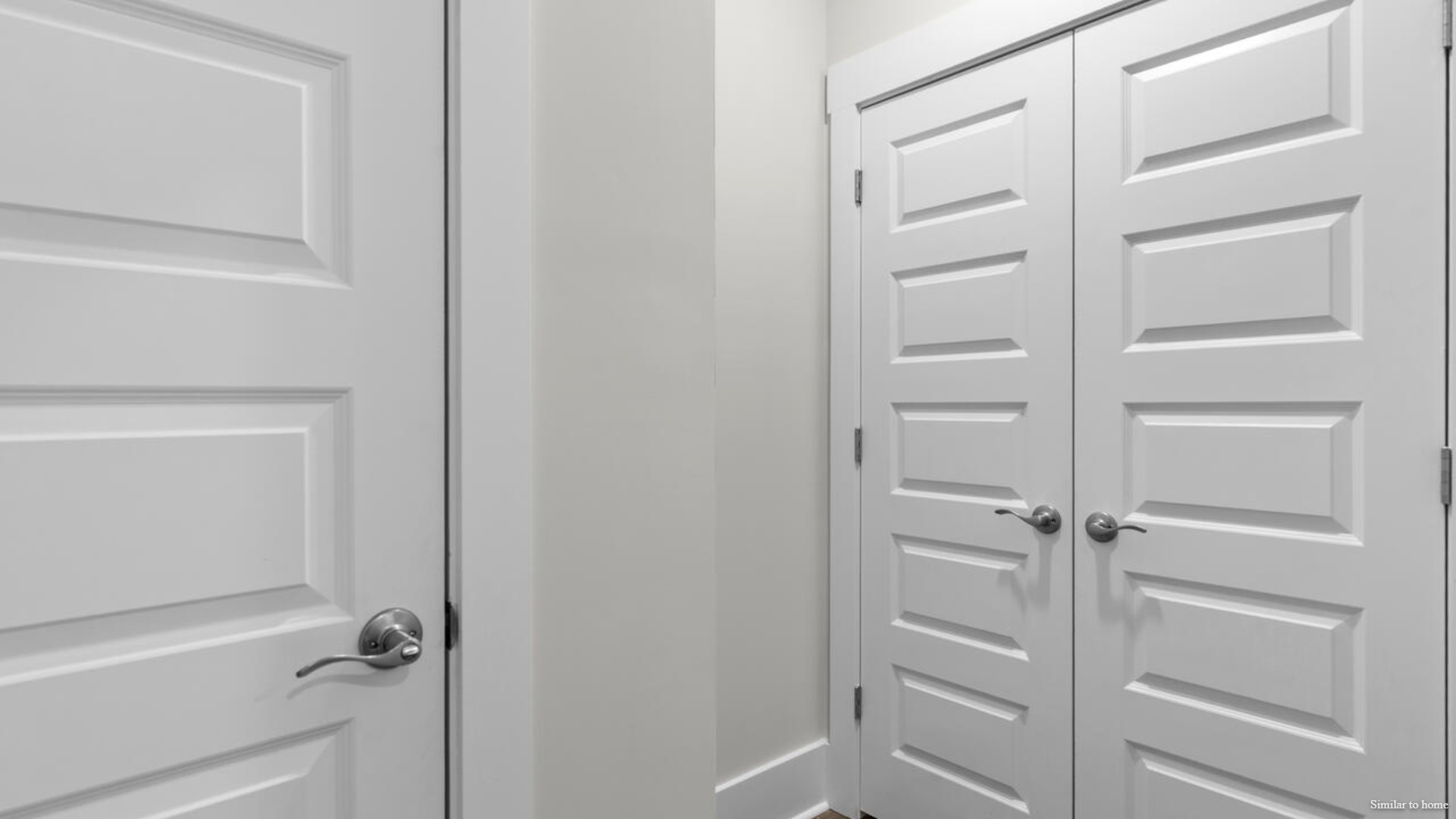 The primary suite bath features a step-in 5' shower and a dual vanity.