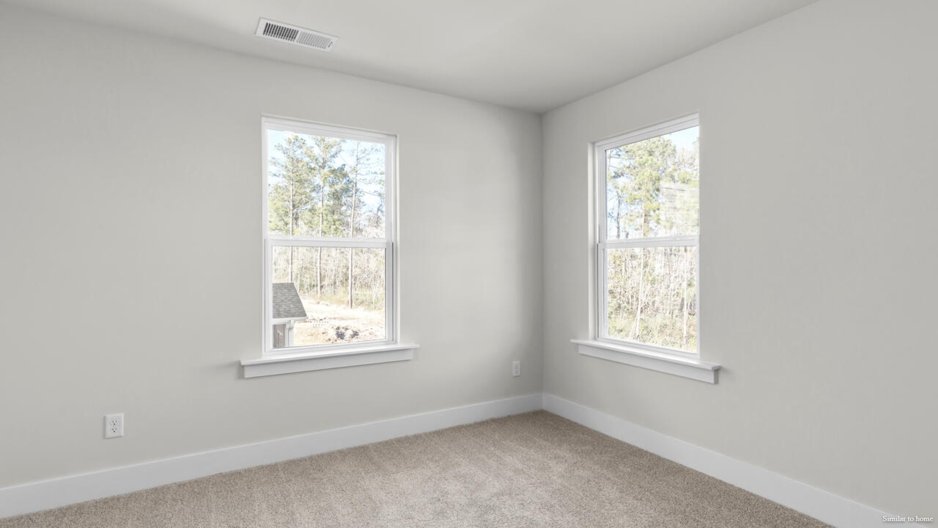 The primary suite bath features a step-in 5' shower and a dual vanity.