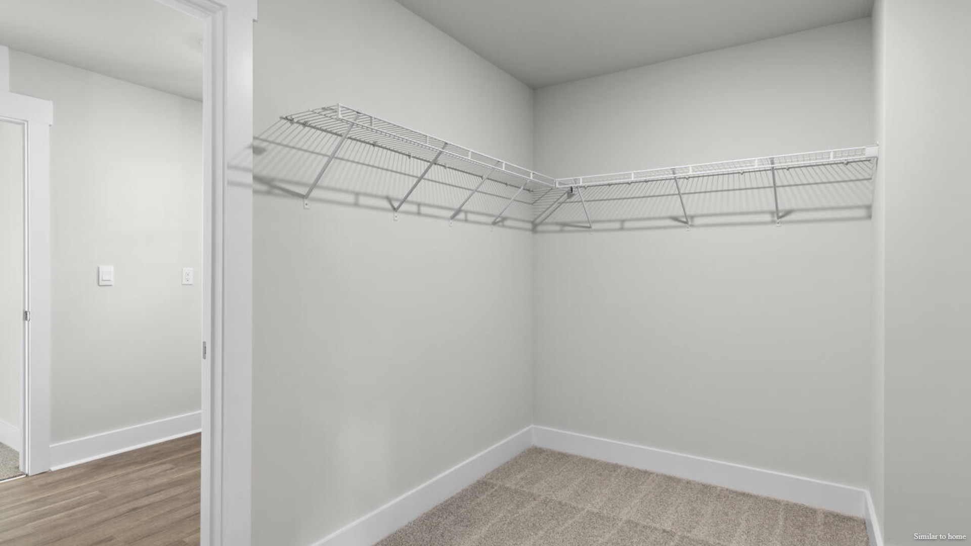 The primary suite bath features a step-in 5' shower and a dual vanity.