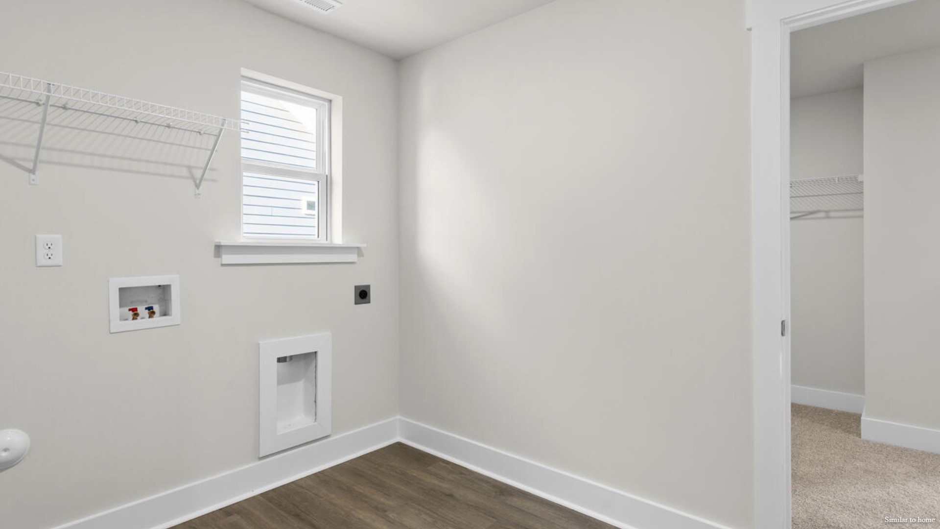 The primary suite bath features a step-in 5' shower and a dual vanity.