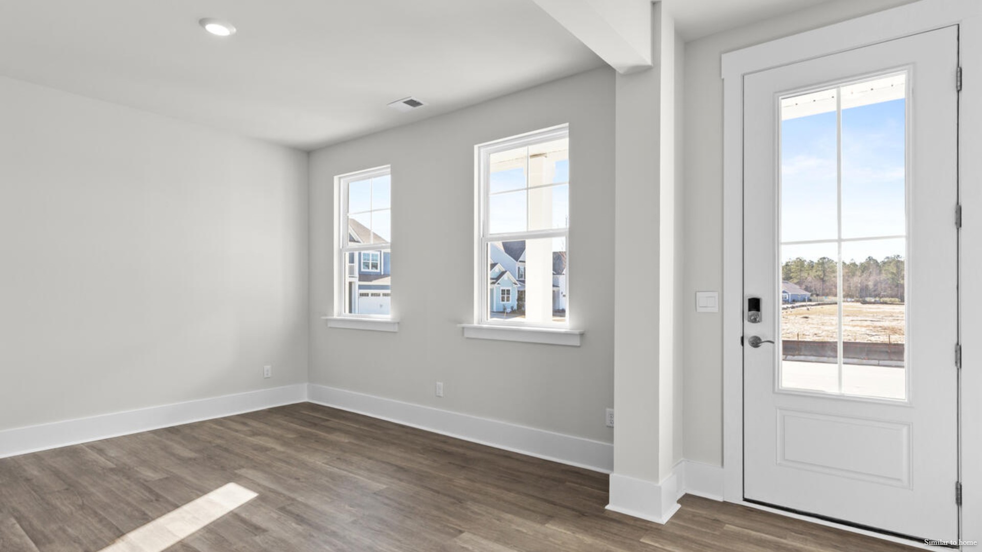 Upon entering the home, you are greeted by a wide foyer and formal dining room.