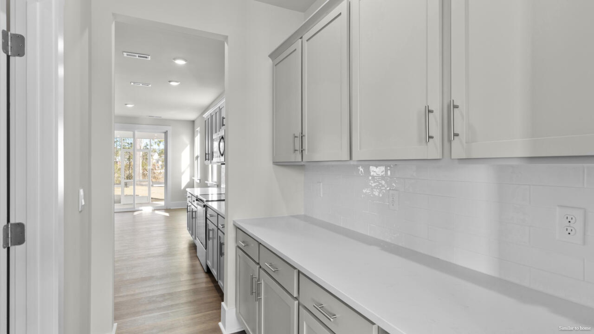 Downstairs there is a formal dining room that leads into a large butler's pantry then the kitchen. The kitchen is loaded with features including a granite island, 36'' cabinets, stainless-steel appliances and is open and expansive with a large island that overlooks the living room and the eat in kitchen area.