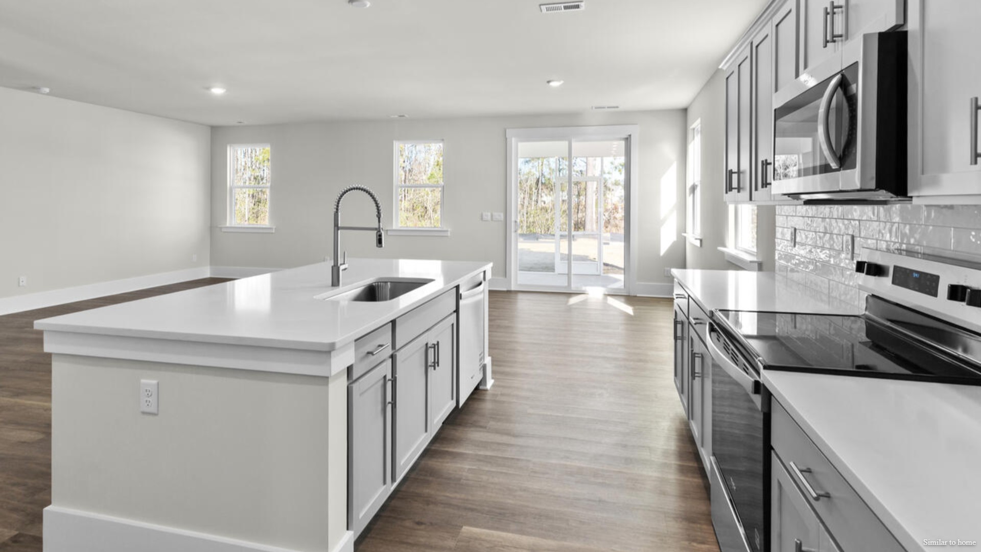Downstairs there is a formal dining room that leads into a large butler's pantry then the kitchen. The kitchen is loaded with features including a granite island, 36'' cabinets, stainless-steel appliances and is open and expansive with a large island that overlooks the living room and the eat in kitchen area.