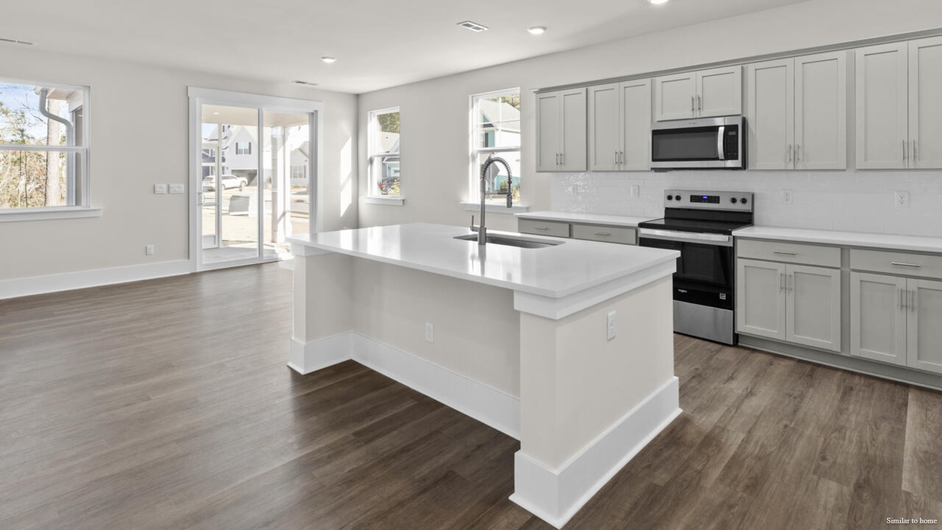 Downstairs there is a formal dining room that leads into a large butler's pantry then the kitchen. The kitchen is loaded with features including a granite island, 36'' cabinets, stainless-steel appliances and is open and expansive with a large island that overlooks the living room and the eat in kitchen area.