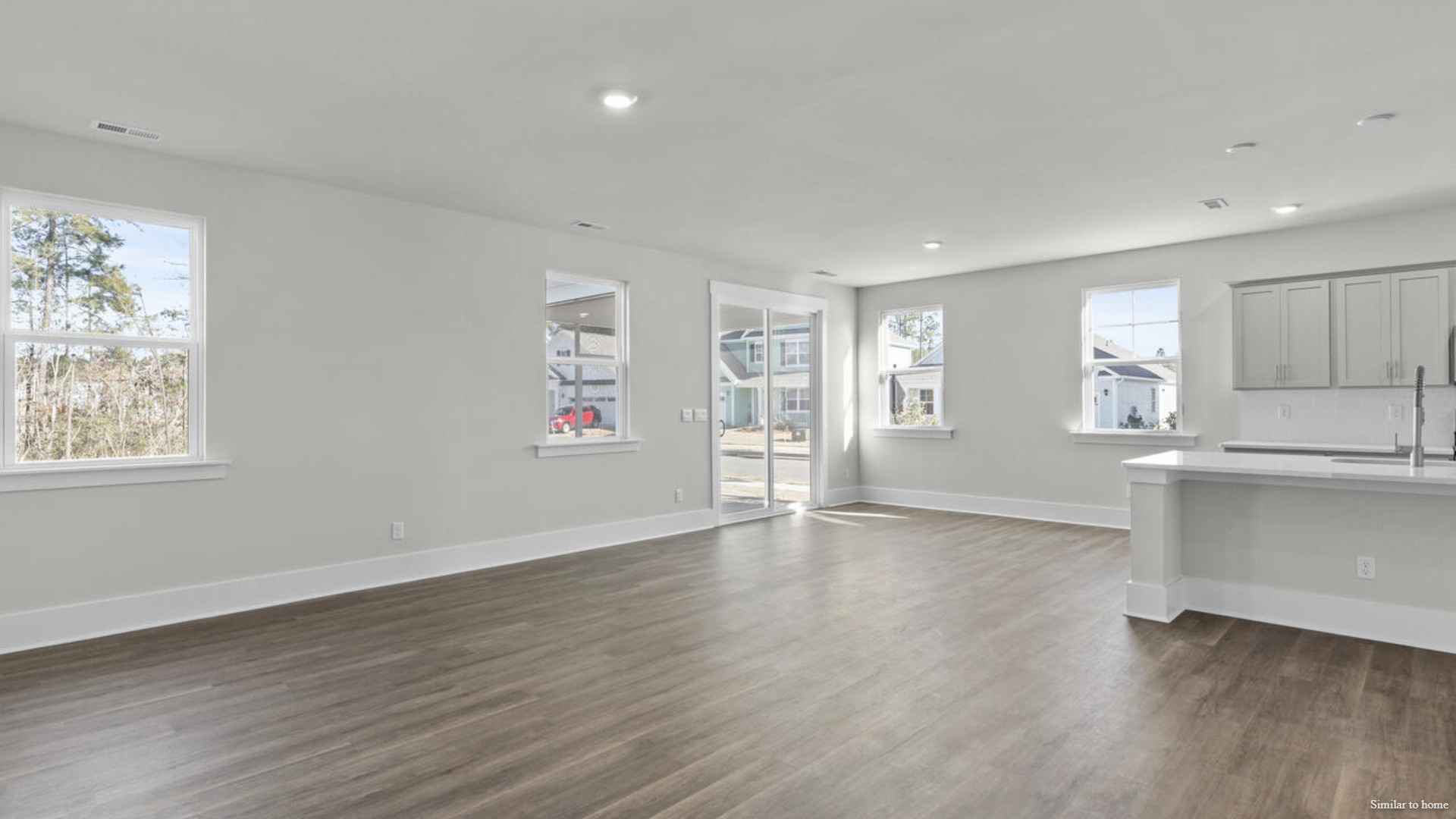 The kitchen is loaded with features including a granite island, 36'' cabinets, stainless-steel appliances and is open and expansive with a large island that overlooks the living room and the eat in kitchen area.