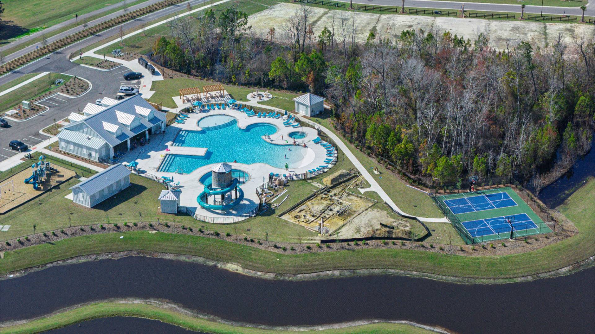 The amenity center that will include a swimming pool, multi-sport court, splashpad, playground, and fire pit, ensuring a well-rounded and enjoyable living experience.