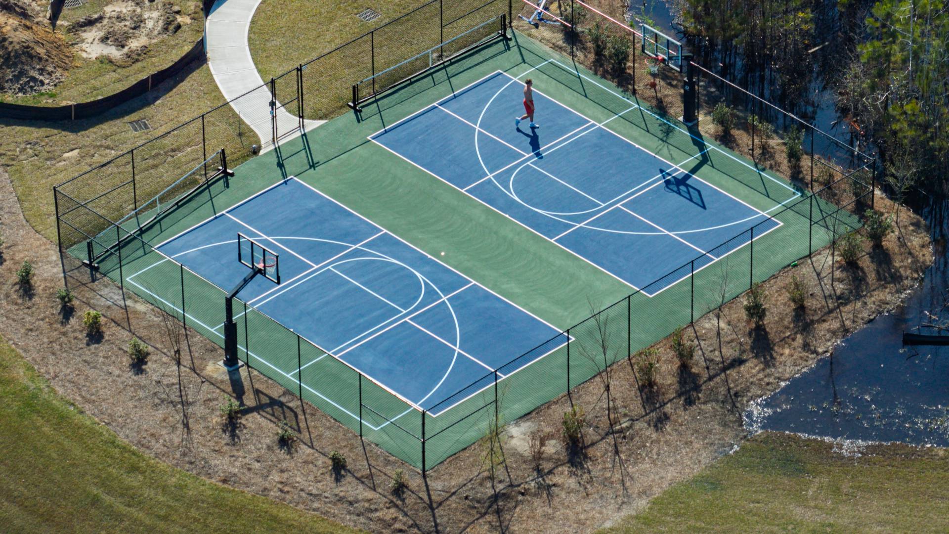 The amenity center that will include a swimming pool, multi-sport court, splashpad, playground, and fire pit, ensuring a well-rounded and enjoyable living experience.