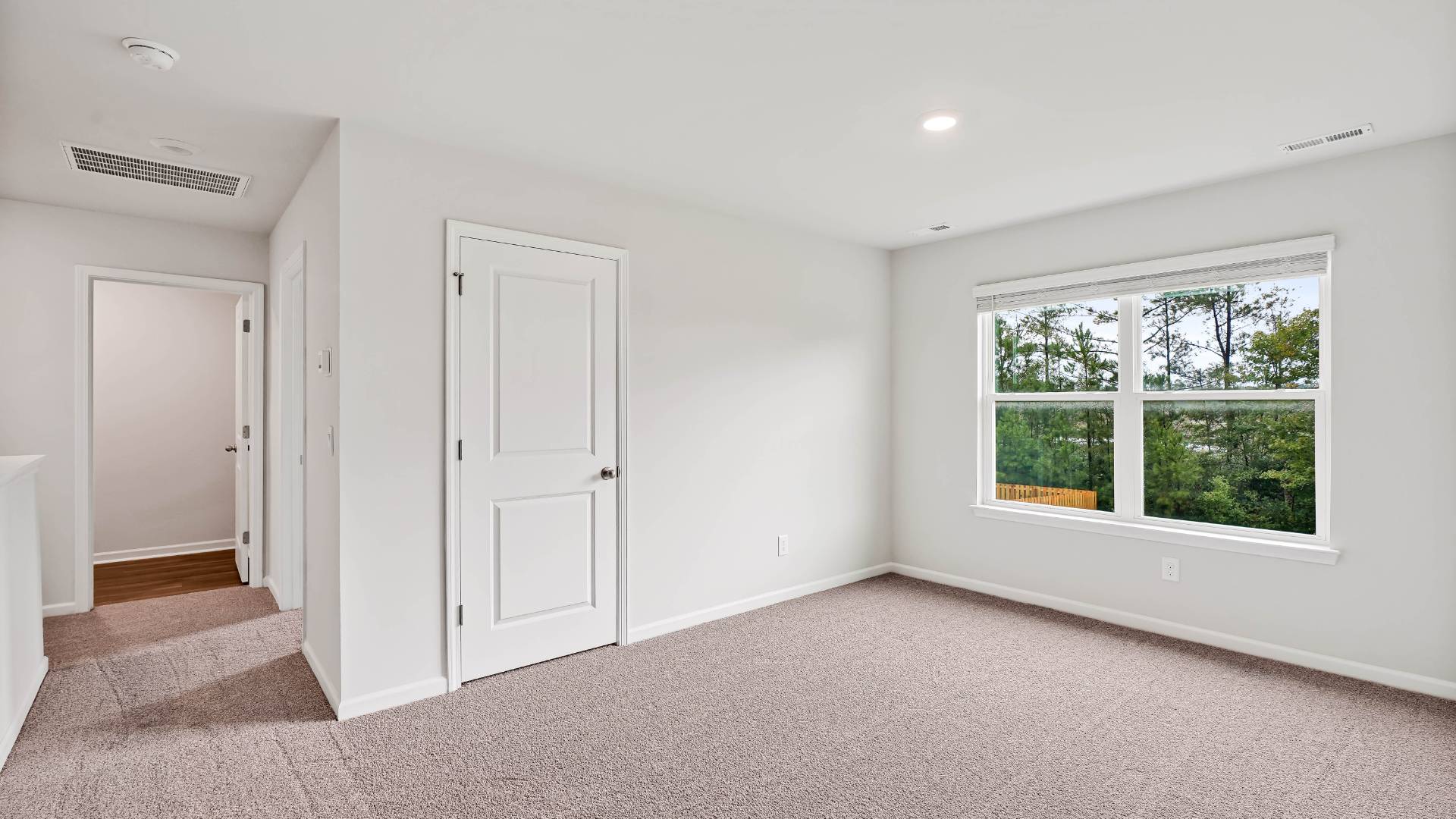 There are 3 additional bedrooms, a full bathroom, a walk-in laundry room, and a loft-style living room on the second level.