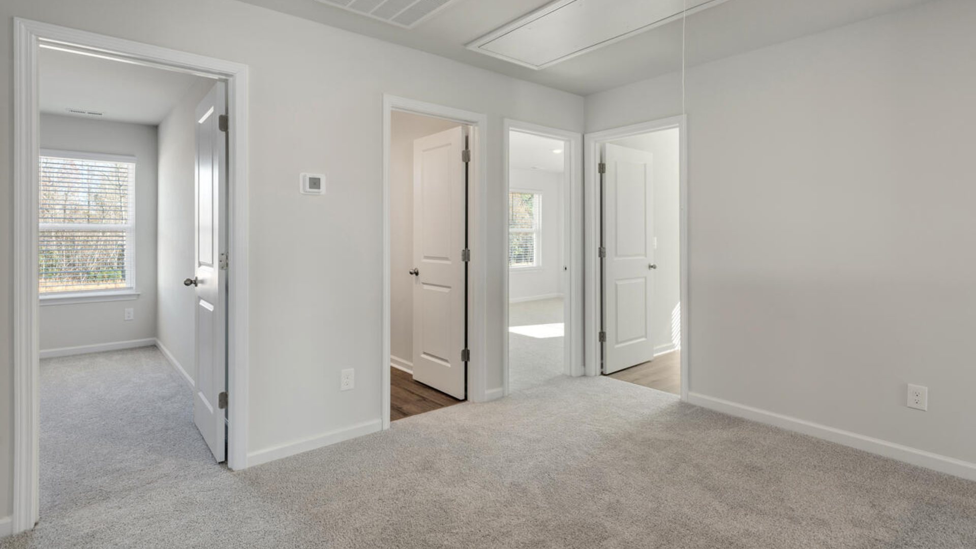 The Tillman floorplan features a first-floor primary suite, formal dining room, a large open living space divided by a kitchen island, and powder room on the first floor. Upstairs you are greeted by an convenient lof