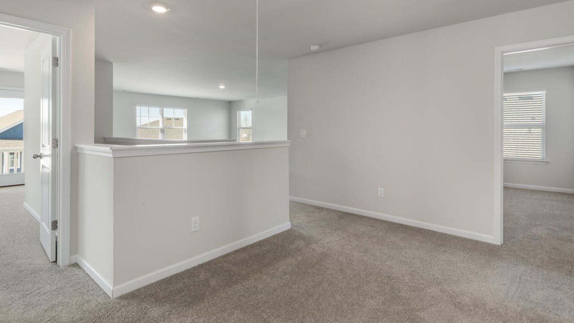 The Tillman floorplan features a first-floor primary suite, formal dining room, a large open living space divided by a kitchen island, and powder room on the first floor. Upstairs you are greeted by an convenient lof