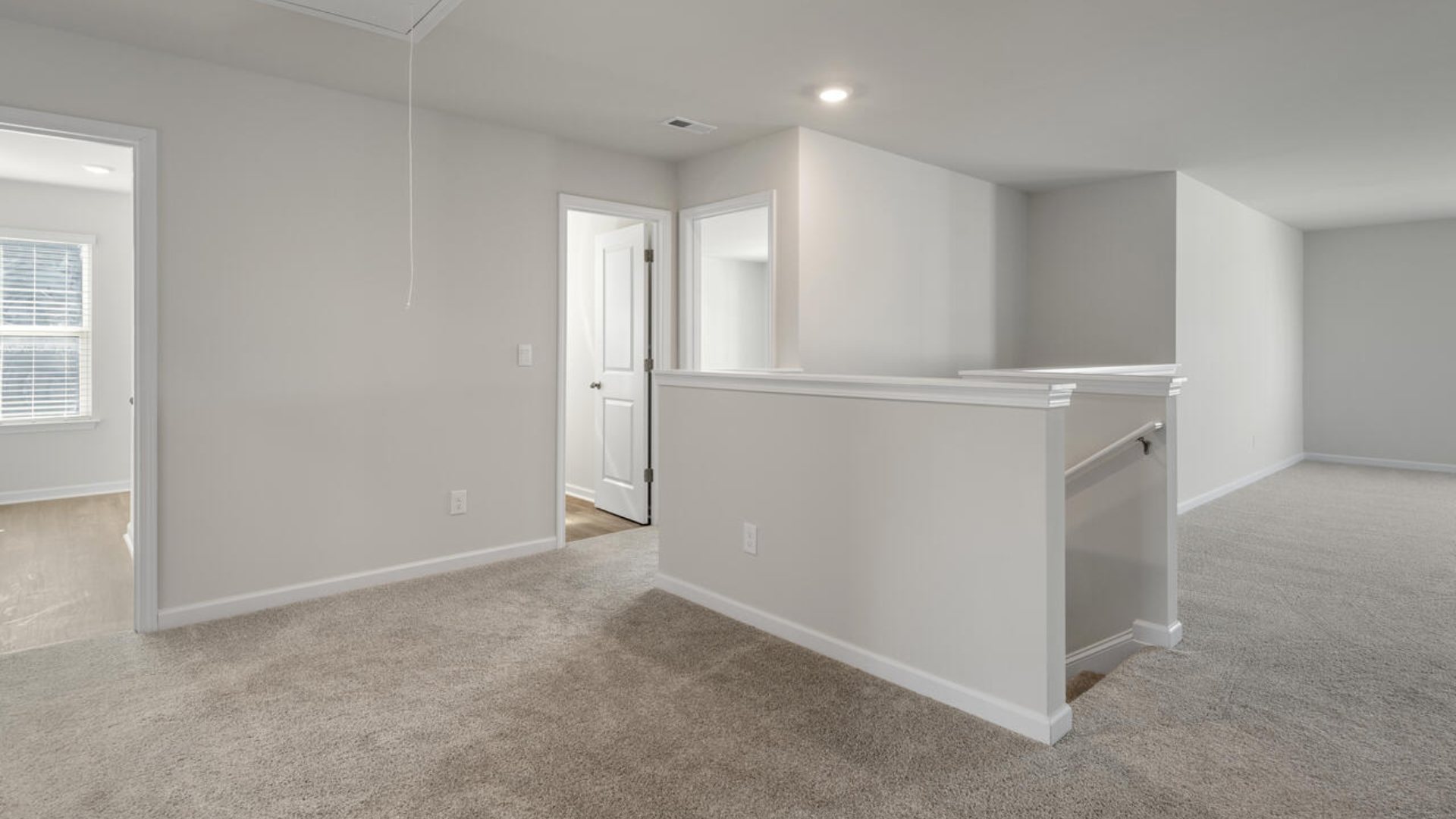 The Tillman floorplan features a first-floor primary suite, formal dining room, a large open living space divided by a kitchen island, and powder room on the first floor. Upstairs you are greeted by an convenient lof