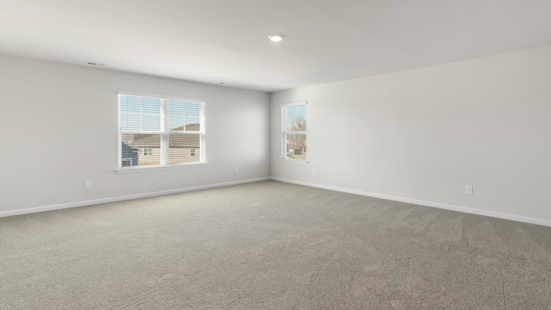 The Tillman floorplan features a first-floor primary suite, formal dining room, a large open living space divided by a kitchen island, and powder room on the first floor. Upstairs you are greeted by an convenient lof
