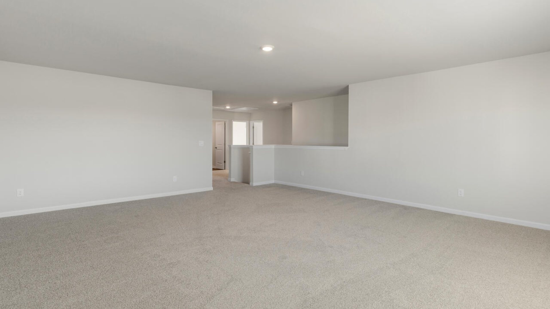 The Tillman floorplan features a first-floor primary suite, formal dining room, a large open living space divided by a kitchen island, and powder room on the first floor. Upstairs you are greeted by an convenient lof